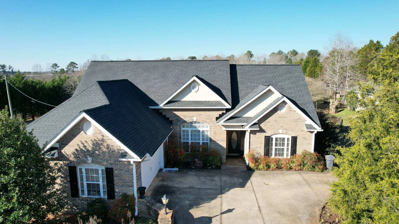 Completed roof on the same multigable brick home