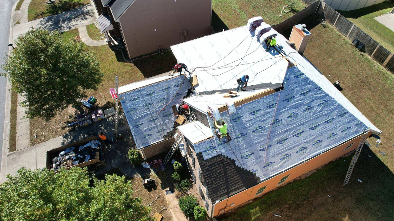Underlayment installation on the same two-story home.